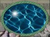 Circular water with reflections in center with stone border
