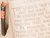 full screen graphic with photo of standing Bible on left and washed out text behind, use for scripture