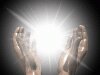 Full screen image of two hands with glowing light between