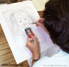 Color photo of artist drawing, talent.