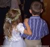 Color photo of little girl and boy, bride and groom.