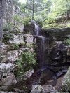color photo of waterfall, rocks, living water, water of life.
